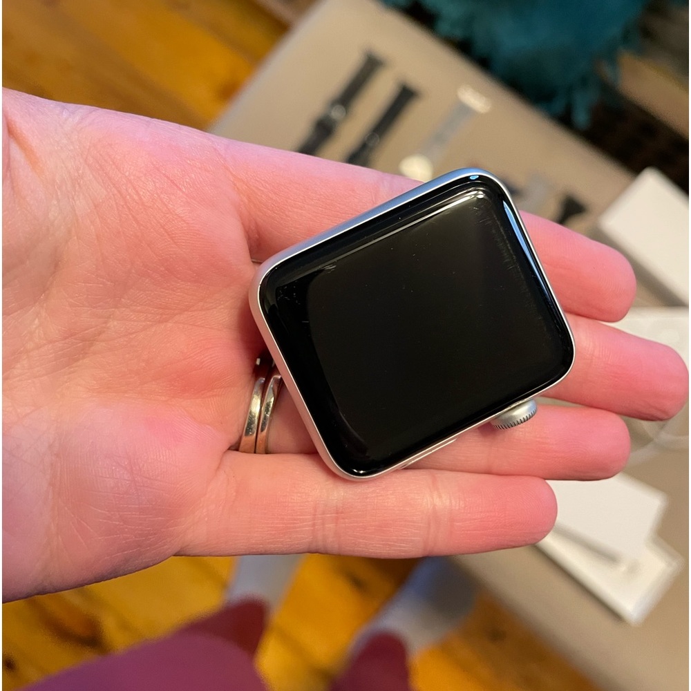 Apple Iwatch series 3. Minor scratches. Silver. Comes with lots of bands